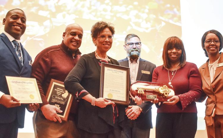 Baldwin County Superintendent Dr. Noris Price (center) was awarded a Certificate of Appreciation and Plaque of Appreciation from the 100 Black Men of Milledgeville Oconee, a certificate of recognition from the Baldwin County Board of Commissioners and a key of the city from Mayor Mary Parham-Copelan and council member Denese Shinholster. Parham-Copelan also read a proclamation naming March 20, 2025, as Dr. Noris Price Day. BAILEY MCCULLY/Staff