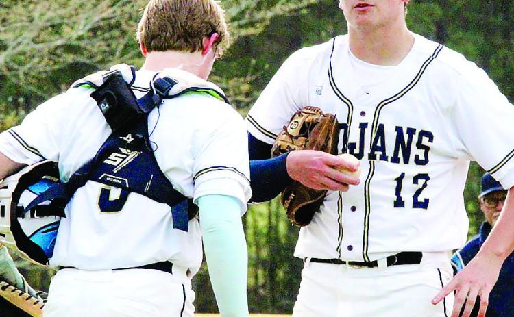 JMA pitcher David Todd (12) meets with catcher Will Adams during a break in play during a previous home game in Milledgeville. TREY NORRIS/Staff