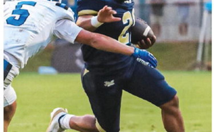 Cayden Wingfield put the game on ice for the Trojans last Friday in Milledgeville as he scored the final TD on a 65-yard run for the end zone. TREY NORRIS/Staff