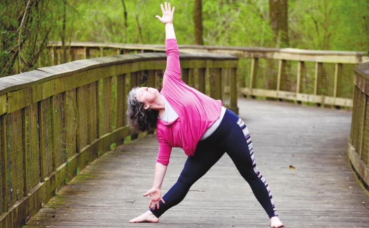 Elizabeth Havey demonstrates her flexibility through yoga. CONTRIBUTED
