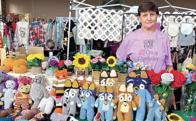 Elena “Crazy Crocheter” Walters displays her hand-made crocheted items, from flowers to t oys. HUDSON TAYLOR/Staff