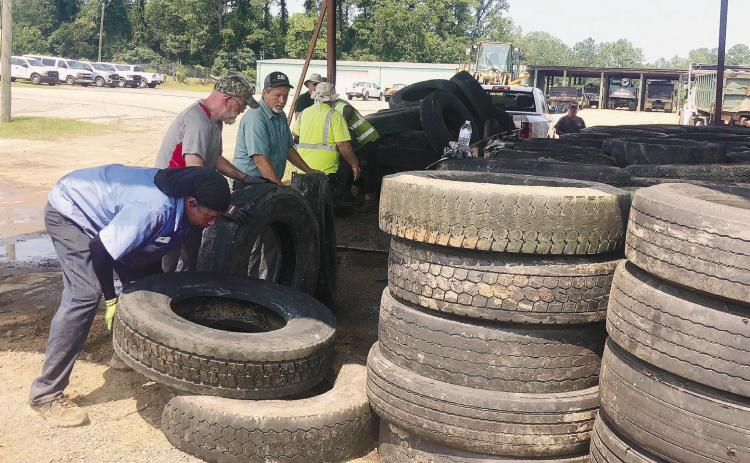 Baldwin Public Works Department employees recycle tires that were brought in. CONTRIUBTED