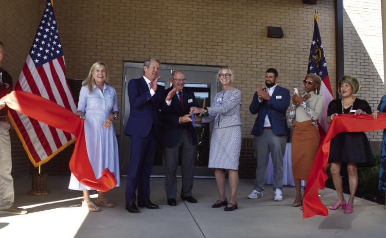 The Georgia Department of Veterans Service hosted a ribbon cutting, with keynote speaker Gov. Brian Kemp (third from left) and his wife, Georgia First Lady Marty Kemp (second form left), to celebrate the opening of the Transitional Support Unit. BAILEY BALLARD/Staff
