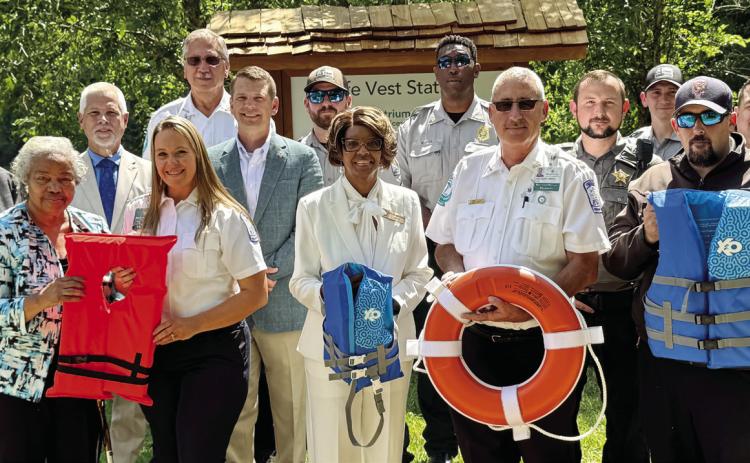 Community leaders gather to debut the life jacket loaner station at Oconee River Greenway Park. CONTRIBUTED