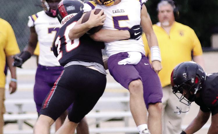 GMC Prep’s Joseph Cox tackles Crawford County quarterback Lawson Cooley last Friday in Milledgeville. TREY NORRIS/ Staff