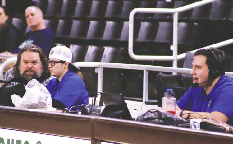 During basketball games, Al Weston (left) helps keep track of the live statistics for Bailey Clark (middle) to put in the program while Luke Winstel (right) provides play-by-play commentary for the game. COURTESY OF GC ATHLETICS