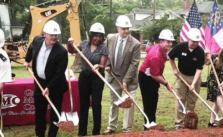 Members of the GMC and Milledgeville community helped break the ground for a new facility that will house several departments that have until now been scattered across the GMC campus. JOEL WHITE/Staff