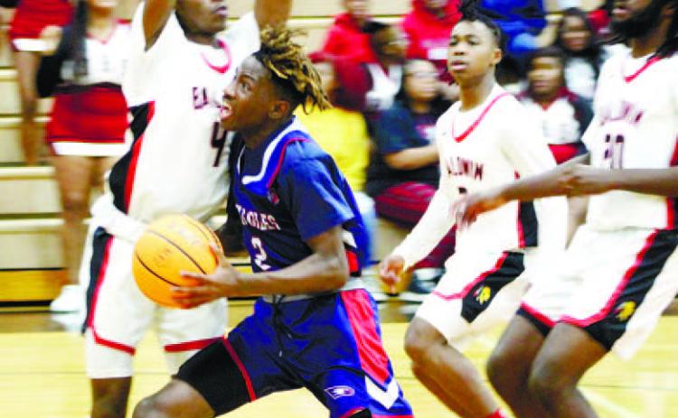 Landon Bonner (2) drives the lane and goes up for a layup while surrounded by Baldwin defenders. ARELLA CASH/Staff