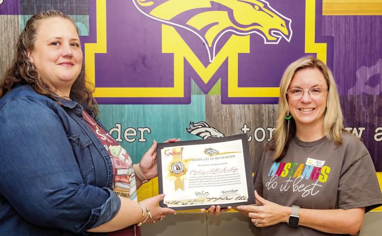 Instructional Coach Natalie Puckett and Principal Terri Carty show off their statewide recognition. CONTRIBUTED