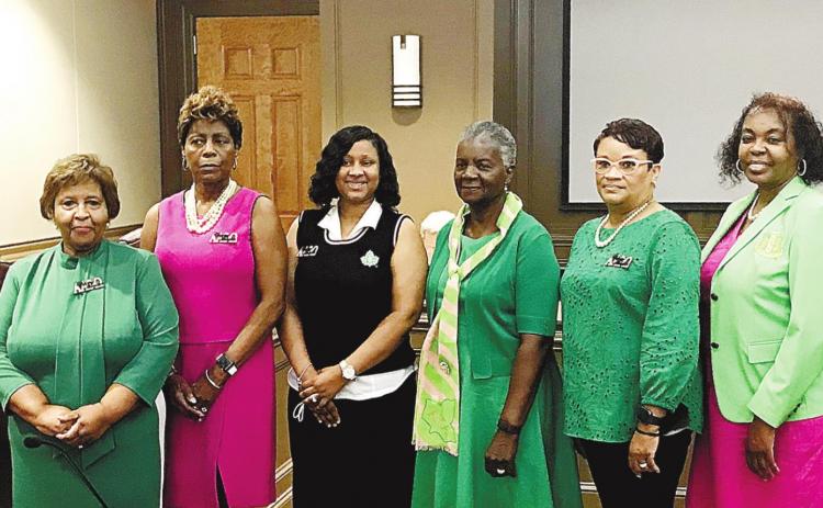 Members of the Alpha Alpha Phi Omega Chapter of the Alpha Kappa Alpha Sorority receive a proclamation from Mayor Mary Parham-Copelan (left), and representatives Collinda Lee and Denese Shinholster (right) that celebrates their chapter for June 19, 2022. JOEL WHITE/Staff